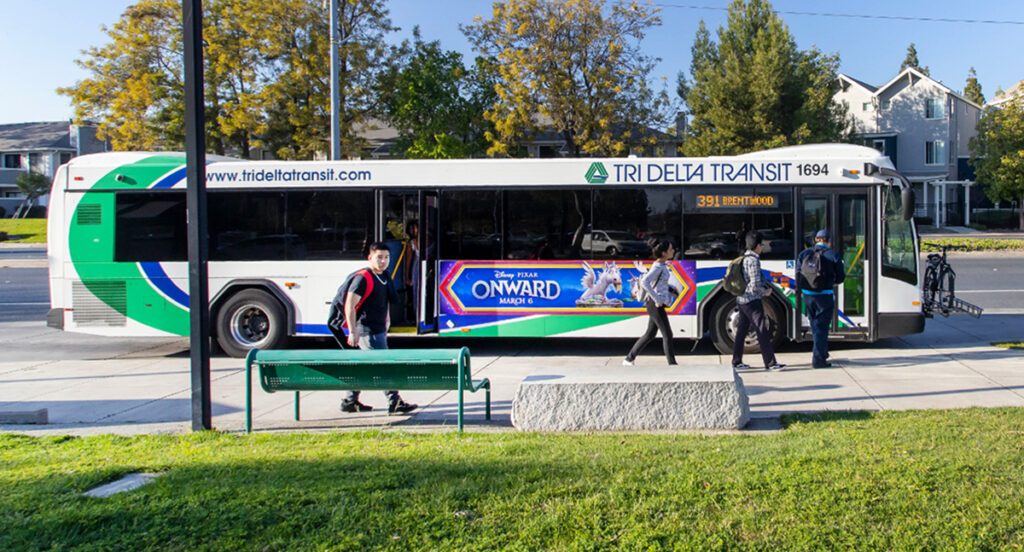 A bus with an ad on it