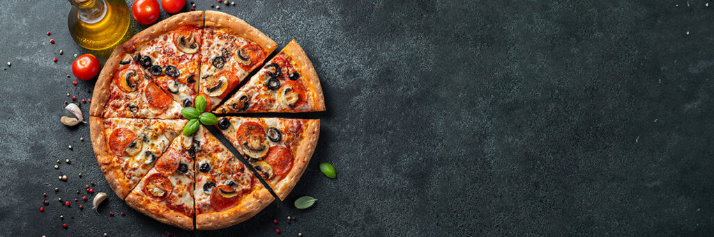 Fresh baked pizza on a stone countertop